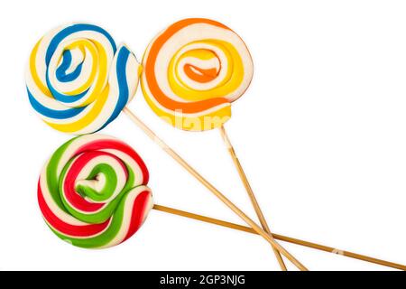 Three sweet colourful Lollipops isolated over white background Stock Photo