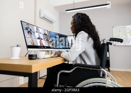Online Virtual Learning Conference. Working On Multiple Screens Stock Photo