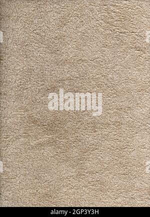 Terry towel. Fabric texture like carpet. Abstract brown texture. Homogeneous brown texture. Brownish background like fabric. Abstract background. Abst Stock Photo