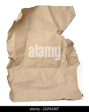 large piece of crumpled brown paper isolated on white background, close up Stock Photo