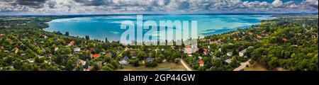 Balatonakarattya, Hungary - Aerial panoramic view of Balatonakarattya, Balatonkenese and Lake Balaton from high above on a cloudy summer day Stock Photo