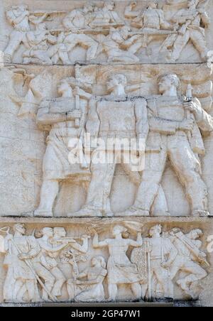 Relief above the Council of Ministers glorifies socialist victory in all fields, Tirana, Albania Stock Photo