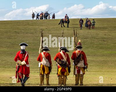 Hanoverian troops and the Jacobite army on the battlefield in re-enactment of Battle of Prestonpans, East Lothian, Scotland, UK Stock Photo