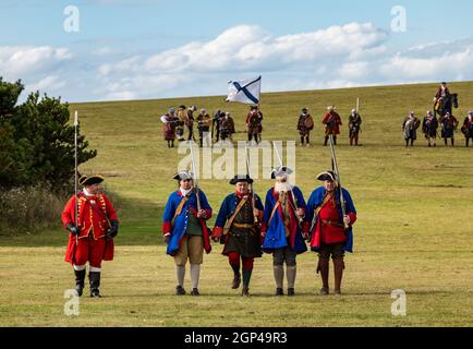 Hanoverian troops and the Jacobite army on the battlefield in re-enactment of Battle of Prestonpans, East Lothian, Scotland, UK Stock Photo