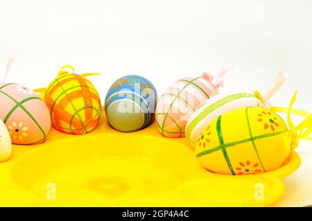 A tray of freshly decorated Easter Eggs being air dried as they rest inside. Stock Photo