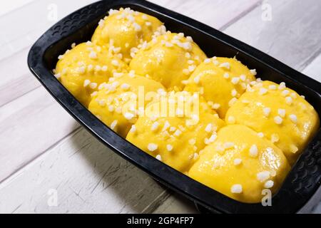 Brioche dough with butter and sugar in a silicone mold before going into the oven Stock Photo