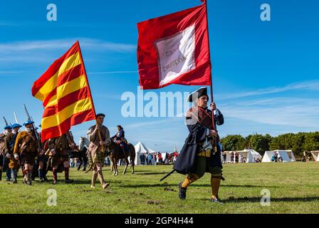 Jacobite Scotsmen in period costume march with flags in re-enactment of Battle of Prestonpans , East Lothian, Scotland, UK Stock Photo