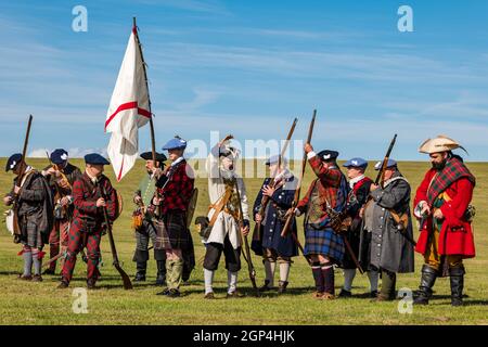 Jacobite Scotsmen in period costume with guns for re-enactment of Battle of Prestonpans , East Lothian, Scotland, UK Stock Photo