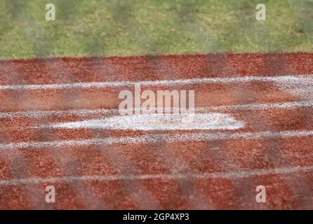 Close up of home plate in an empty baseball field Stock Photo