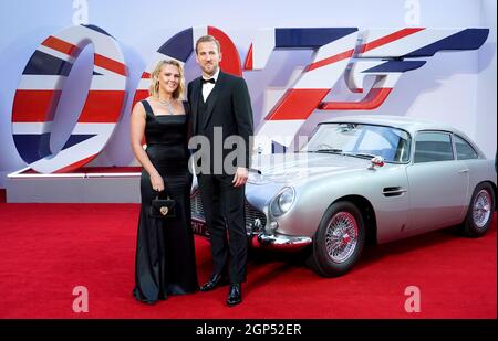 Katie Goodland and Harry Kane attending the World Premiere of No Time To Die, at the Royal Albert Hall in London. Picture date: Tuesday September 28, 2021. Stock Photo