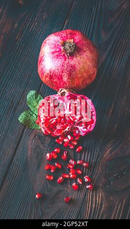 Fresh pomegranate on the wooden table: cross section Stock Photo