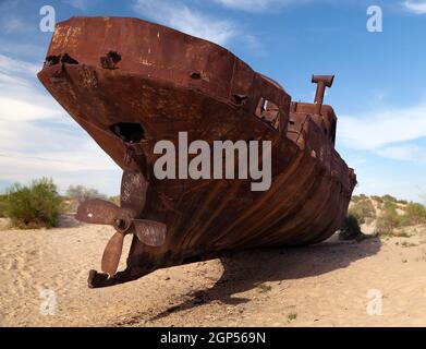 Boats in desert around Moynaq, Muynak or Moynoq - Aral sea or Aral lake - Uzbekistan - asia Stock Photo