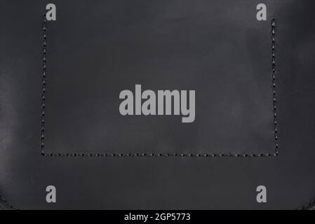 texture of black genuine leather with seam, full frame Stock Photo