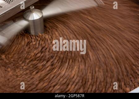 Overhead view of coffee beans in roaster Stock Photo