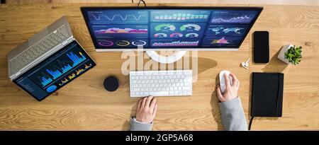 Business Woman Analyst Using KPI Data On Computer Stock Photo