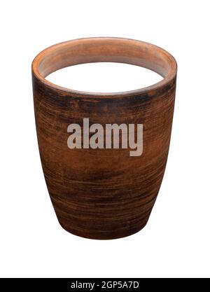 simple rough clay mug without handle with milk isolated on white background Stock Photo