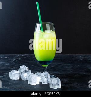 Blue and green cold drink with blue liqueur, soda, with citrus zest Stock Photo
