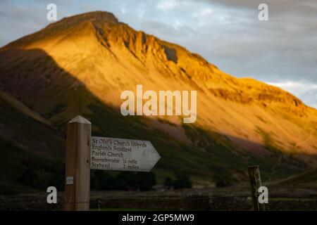Footpath signpost, Wasdale Head, Cumbria with Great Gable in the background Stock Photo