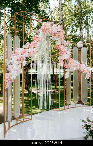 wedding ceremony in the woods among the trees on the green track Stock Photo