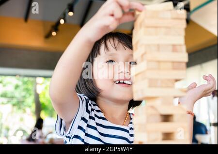 People playing at “Jenga” at the game and toy fair of Quebec City - La  Revanche, board game, ExpoCité fair center Stock Photo - Alamy