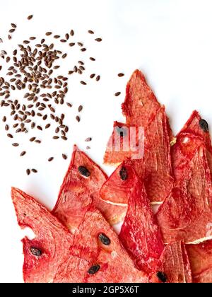 Dried watermelon and melon chips homemade sweet healthy dessert isolated on white. Stock Photo