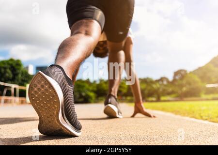 Asian young athlete sport runner black man active ready to start running training at the outdoor on the treadmill for a step forward, healthy exercise Stock Photo