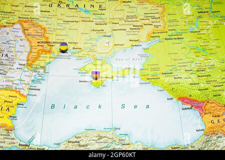 Close up view to Crimea with Russian flag pin. New land and sea borders of Ukraine and Russia territory on political map of Europe, geographical globe Stock Photo