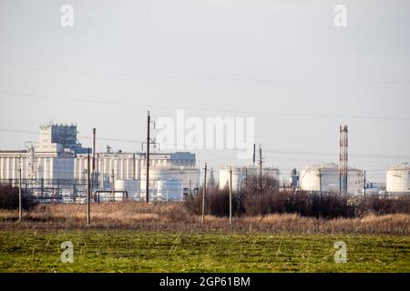 Refinery. Reservoirs for storage of refinery products. Rectification columns. Distillation columns, pipes and other equipment furnaces refinery. The o Stock Photo