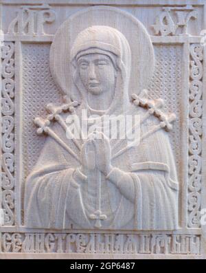 Carving on the machine with numerical control. Cut cutter machine icon of the Virgin Mary. Stock Photo