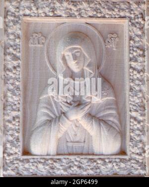 Carving on the machine with numerical control. Cut cutter machine icon of the Virgin Mary. Stock Photo