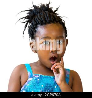 Close up portrait of little african girl with surprising face expression.Kid with open mount and one hand on cheek isolated on white background. Stock Photo
