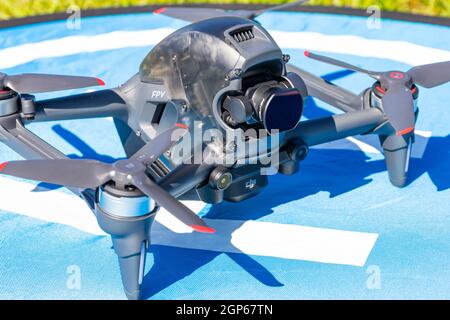 Moscow Russia - 30 may 2021: Close-up picture new aerial DJI FPV drone on fly landing pad. Top front view uav quad copter with 4K 60 fps Digital Camer Stock Photo