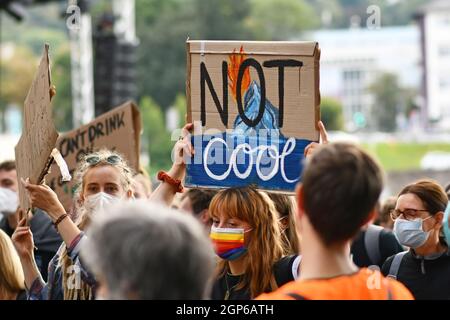 Heidelberg, Germany - 24th September 2021: Sign held up by young woman saying 'Not cool' at Global Climate Strike demonstration Stock Photo