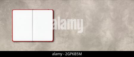 Red open lined notebook mockup isolated on concrete background. Horizontal banner Stock Photo