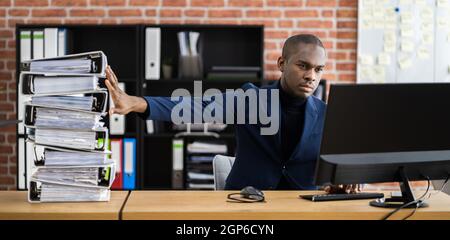 Digital Transformation. Accountant Using E Invoice Tax Document Software Stock Photo