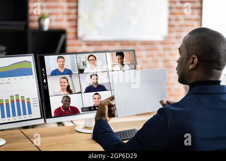 African American Showing Chart In Virtual Video Conference Call Stock Photo
