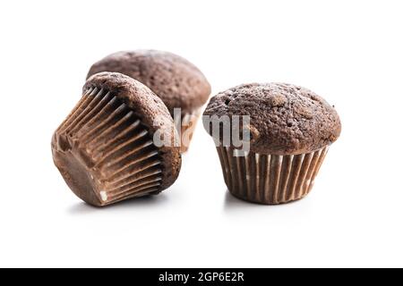 Chocolate muffins. Sweet dark cupcakes isolated on white background. Stock Photo
