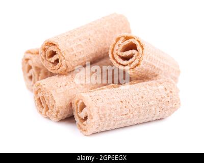 Crispy wafer rolls isolated on white background. Cinnamon flavored waffle. Stock Photo