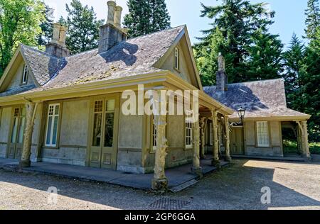 Summer at Balmoral Castle, traditional wooden rural Scottish single storey lodge Royal Deeside, Crathie Estate, Cairngorms National Park, Scotland UK. Stock Photo