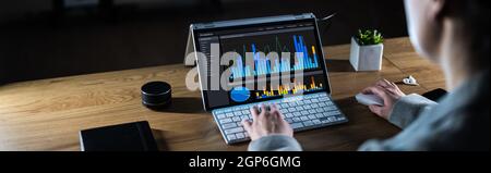 Business Woman Analyst Using KPI Data On Computer Stock Photo