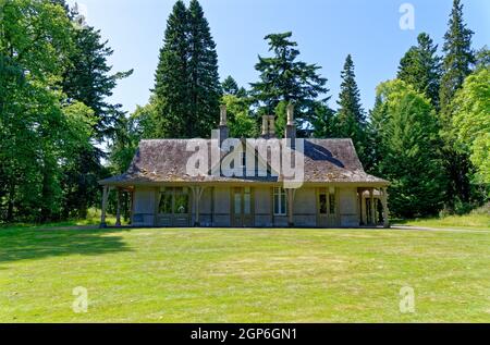 Summer at Balmoral Castle, traditional wooden rural Scottish single storey lodge Royal Deeside, Crathie Estate, Cairngorms National Park, Scotland UK. Stock Photo