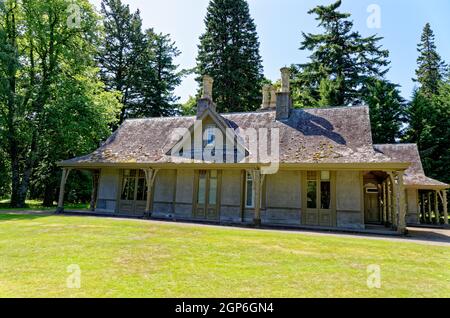 Summer at Balmoral Castle, traditional wooden rural Scottish single storey lodge Royal Deeside, Crathie Estate, Cairngorms National Park, Scotland UK. Stock Photo