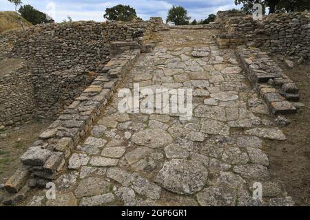 The stone ramp at the entrance to the legendary Ancient City of Troy, famous for the Trojan Horse and War, is near the town of Tevfikiye, Turkey. Stock Photo