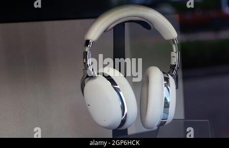 White big headphones exposed in the shop windos Stock Photo