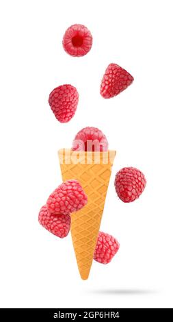 Isolated flying fruit. Eight Raspberry fruits falling down in ice cream cone with clipping path. Accurate retouching fruits for package design element Stock Photo