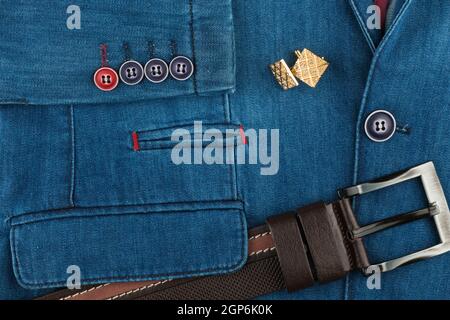 Denim suit, brown leather belt and cufflinks. Fashion background. Top view Stock Photo