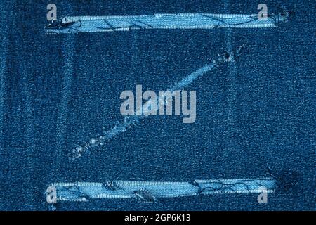Torn jeans fabric in the shape of Z, top view Stock Photo