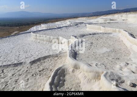 The travertines of Pamukkale are a series of cascading thermal pools near the ancient Greek city of Hierapolis in Turkey. Stock Photo