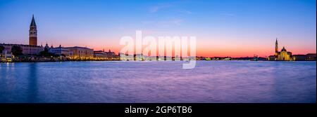 Panoramic view, Bacino San Marco at dawn, on the left the Campanile bell tower and Doge's Palace, on the right the church of San Giorgio Maggiore Stock Photo