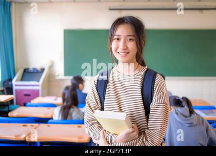 Portrait of  asian cute student teenager girl in  classroom Stock Photo